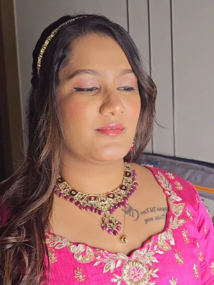 Another angle of Shreya's look, showing her soft waves and pretty hair accessory.