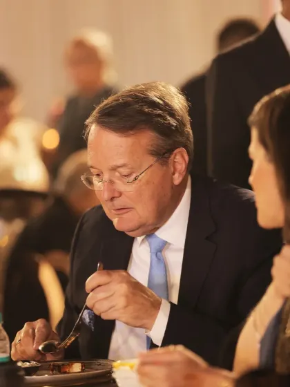 An international guest savours a bite at one of our events. Our global cuisine is designed to appeal to palates from all over the world, ensuring everyone feels welcome.