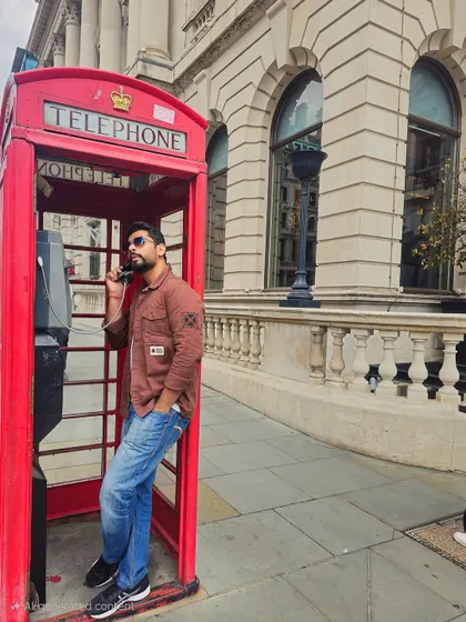 A classic tourist shot in a London telephone booth. This playful and stylish image is great for campaigns targeting a younger audience or for travel-related storytelling.