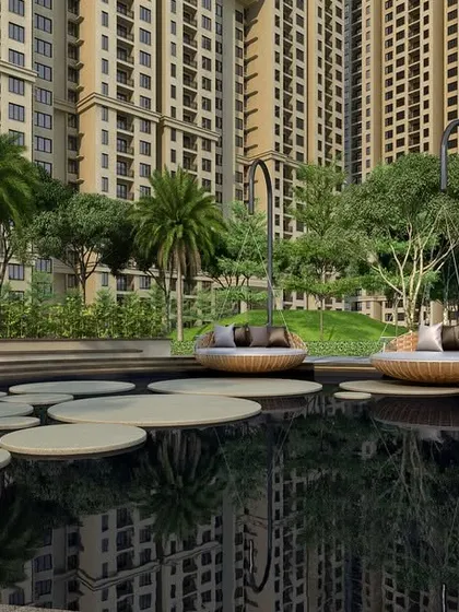 A unique water feature at Casagrand Sun City with floating platforms and submerged loungers, creating an imaginative and luxurious space for relaxation.