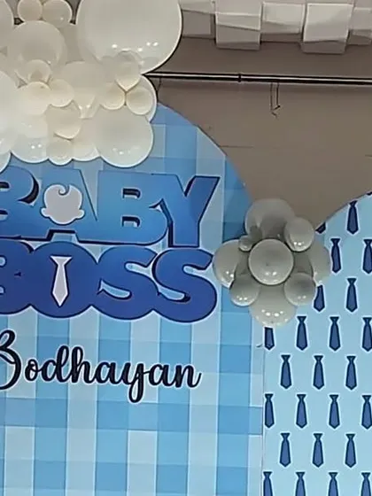 A close-up of the "Baby Boss" backdrop from the previous setup. This shows the detail of the 3D lettering and the custom gingham and tie patterns used to match the theme perfectly.