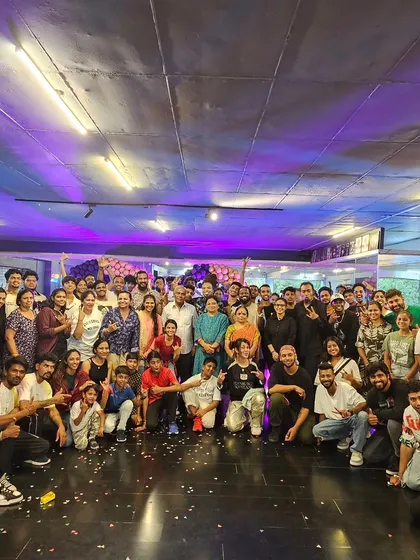 This is the family. A shot from our 17th anniversary, celebrating years of building the Bangalore street dance scene. When you join my classes, you're not just a student, you become part of a community that supports and grows together.