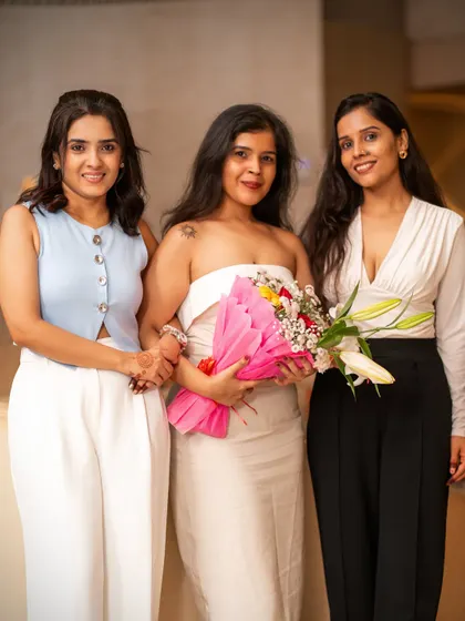 Celebrating moments, big and small. Guests enjoying a special occasion with flowers and friends at our weekly rooftop party.