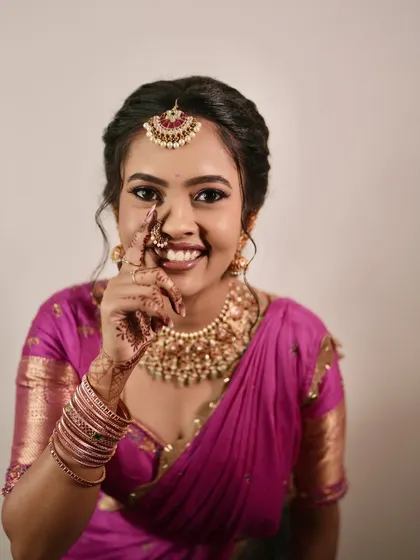 A playful and happy shot of the bride-to-be. Her smile is infectious, and her makeup is flawless.