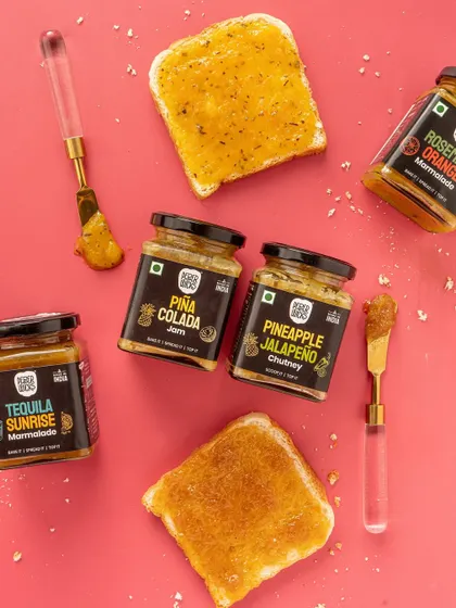 A colorful flat-lay of jams and marmalades for Pepper Wicks. I use bold backgrounds and simple props to make the product packaging pop, ideal for e-commerce listings and brand websites.