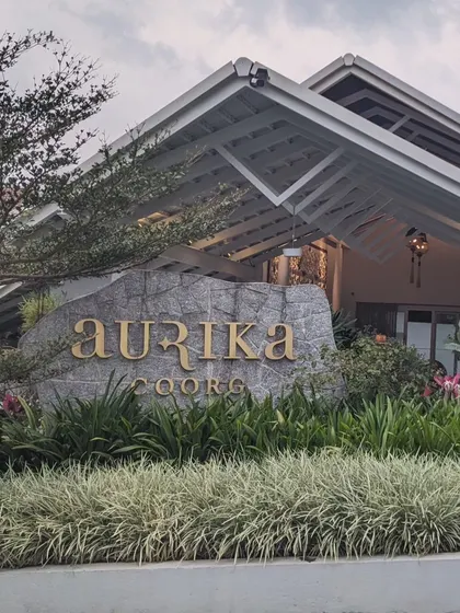 The grand entrance to Aurika Coorg, a premier luxury resort I partner with for high-end corporate retreats that blend opulence with nature.