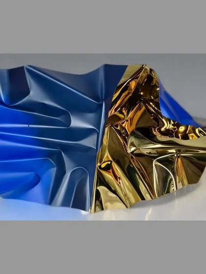 "Meteor 131" captures the moment the sun hits the ocean, with warm gold and cool blue tones meeting on a single stainless steel form.