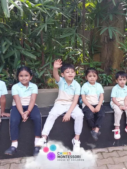 A group of friends take a break on a bench at Discovery Village, enjoying the scenery and each other's company.
