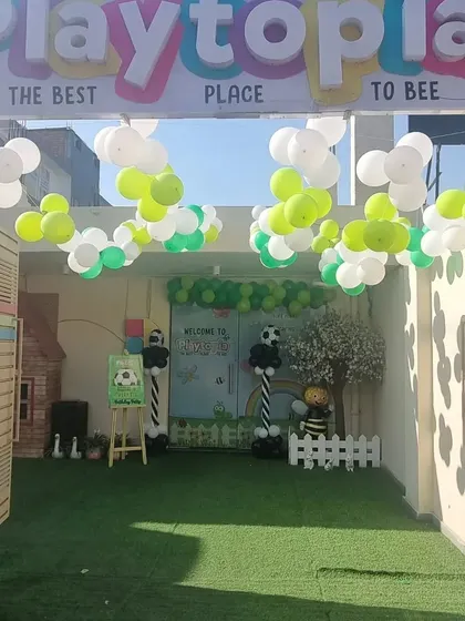 Our entrance decorated for a football-themed party. The green turf and balloon goalpost set the stage for a sporty celebration.