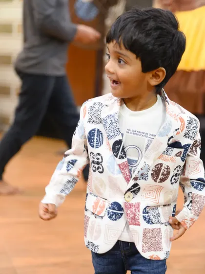 The birthday boy, Rahil, looking excited and happy during his party.