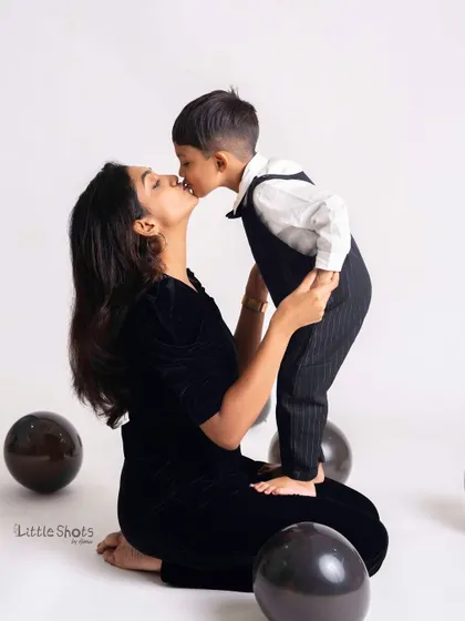 A mother's gentle kiss for her son. This beautiful, emotional moment captures the profound love between a mother and her child.
