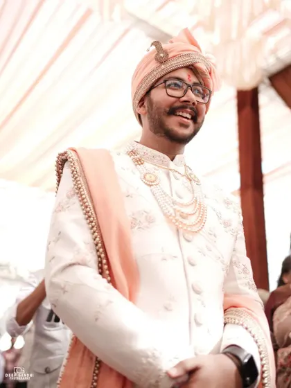 The groom's happy and proud smile as he sees his bride. We make sure to capture these priceless reactions during the ceremony.