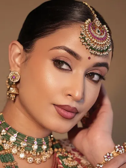 A close-up of the hazel eyes and the soft, blended eyeshadow. This look is a masterclass in creating a sophisticated yet glamorous bridal look.