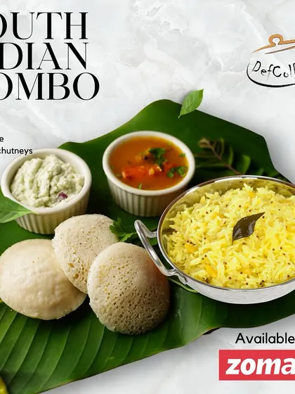 A beautifully presented South Indian combo, featuring Sambhar, Rava Idlis, Lemon Rice, and two chutneys, served on a traditional banana leaf.