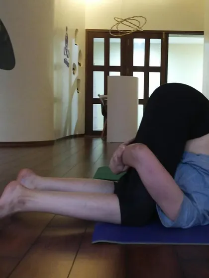 Karnapidasana (Ear Pressure Pose) is a deep forward bend that calms the mind and stretches the entire spine.