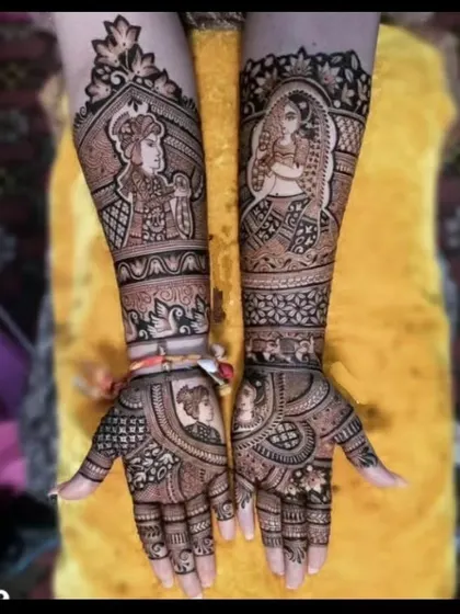 A stunning Radha-Krishna themed bridal mehndi. The divine couple is featured on the forearms, with smaller portraits and intricate patterns filling the rest of the space.