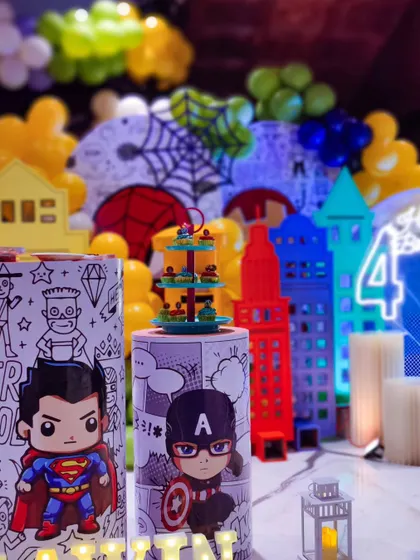 A close-up on the superhero plinths, which are a key feature of this theme. The detailed comic-style illustrations make them stand out.
