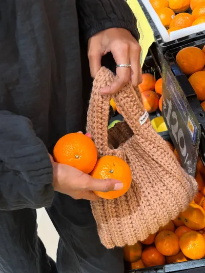 Taking my handmade Japanese knot bag out for a spin at the grocery store. It’s surprisingly spacious and perfect for carrying a few things while keeping your hands free.