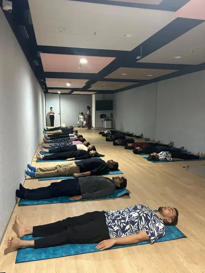 A long view of participants in deep relaxation during a sound bath, showcasing the peaceful environment I create.