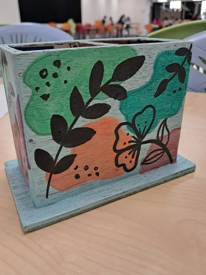 The combination of green, orange, and purple on this pencil stand is so vibrant and full of life.