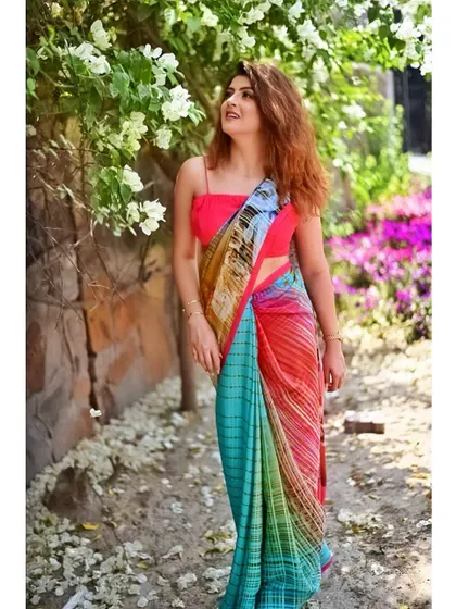 This vibrant look was for a farewell party, where the makeup needed to match the colorful saree. I created a look with a pop of color on the eyes and a flawless base, ensuring she stood out while looking elegant and age-appropriate.