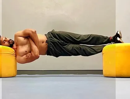 Holding the side plank with focus and breath. Each moment in a challenging pose is an opportunity to build mental fortitude as well as physical strength.