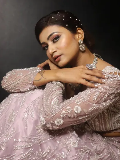 A close-up that highlights the soft, romantic eye makeup and flawless skin. This look is perfect for an engagement, reception, or any special event.