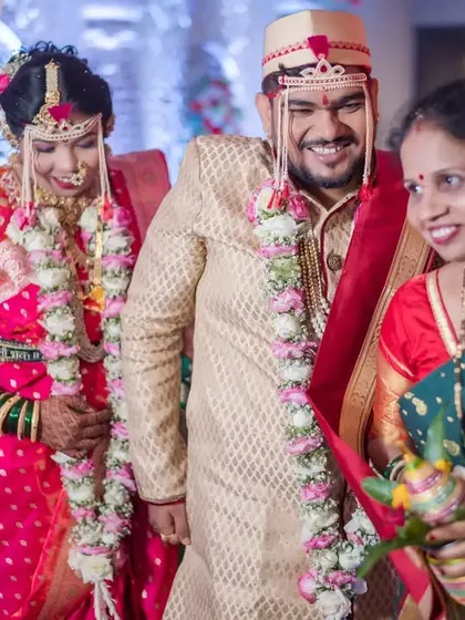 The newlyweds walk with the groom's mother, a heartwarming family moment that we love to capture.