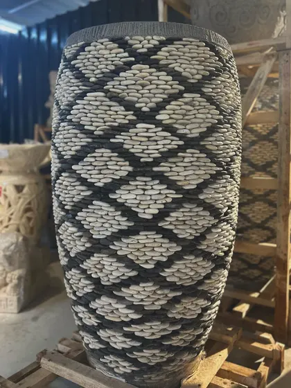 The detail on this majestic 4-foot tall pebble planter is just breathtaking. Each stone is placed by hand by local artisans, creating a unique, textural masterpiece for your home or garden.