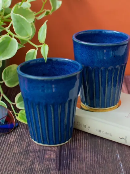 These deep blue ceramic tumblers are a versatile addition to my drinkware collection. Their ribbed texture provides a comfortable grip, and the vibrant color makes them a joy to use for water, lassi, or any cold beverage.