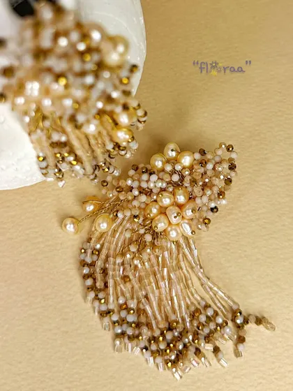 I designed these floral earrings with freshwater pearls and a golden touch to be a stunning, versatile piece for any wardrobe.