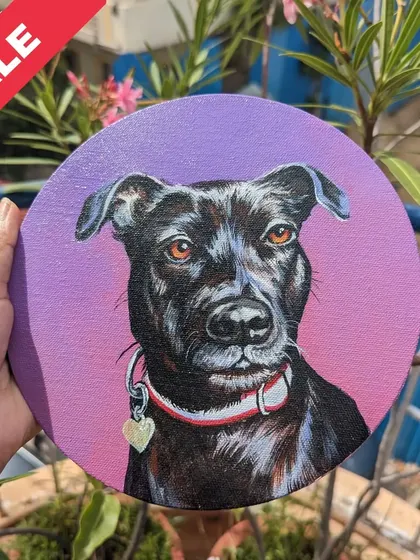 A classic portrait of a beautiful black dog on a vibrant purple background. Painted on a 6-inch round canvas, this piece is ready to be displayed.