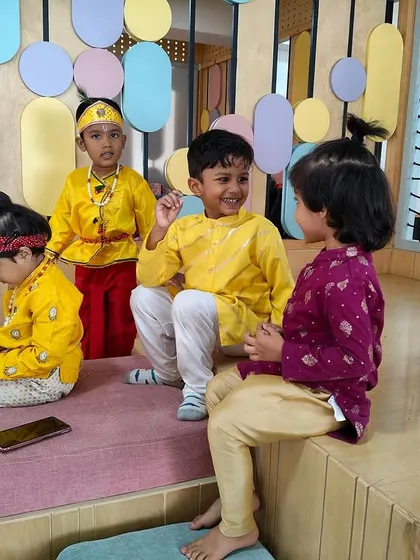 A quiet moment amidst the festivities, as our little Krishnas sit and chat together. Friendships blossom during these shared cultural experiences.