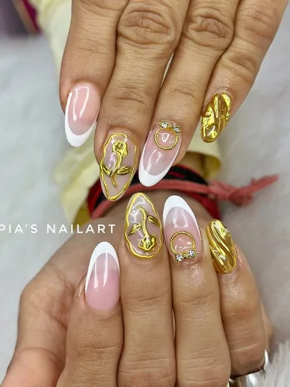 A classic French manicure with a touch of gold. This set features sculpted 3D chrome roses and accents for a look that is pure luxury.