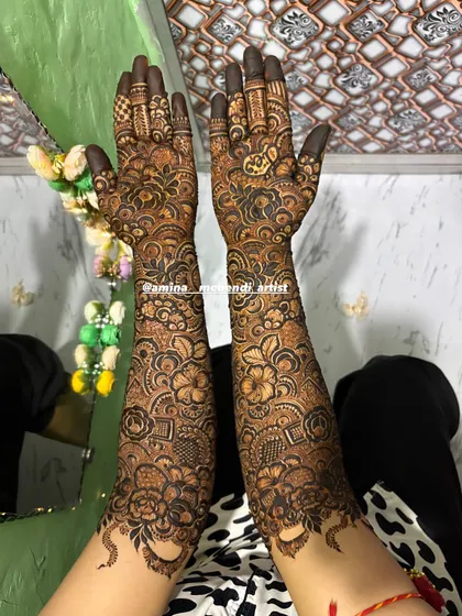 This is an example of my signature full-arm floral mehendi. I love creating dense, intricate patterns with elements like roses, paisleys, and detailed fillers to give you a rich and traditional look for any celebration.
