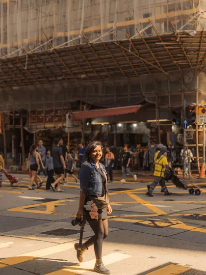 A smiling shot from the streets of Hong Kong. This photo captures the joy of being a travel photographer and exploring a new city.