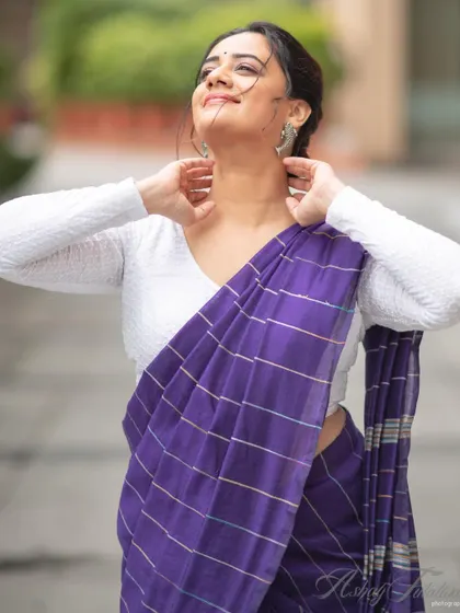 A candid moment that captures the light and airy feel of the cotton saree.
