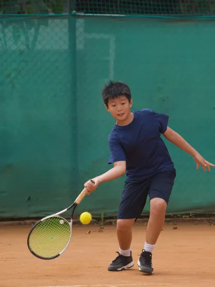 A junior player from Singapore making contact with the ball. Our camps are designed to be the ultimate game-changer for young, aspiring athletes.