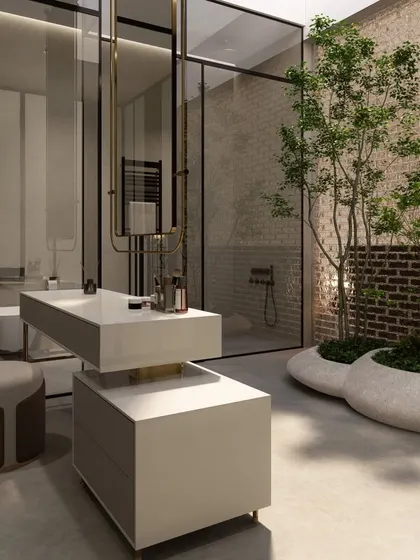 We designed this luxury bathroom to feel like a private spa, complete with an indoor courtyard that brings a living tree into the space. The glass partitions and minimalist vanity create a sense of openness, blurring the line between the built environment and nature.