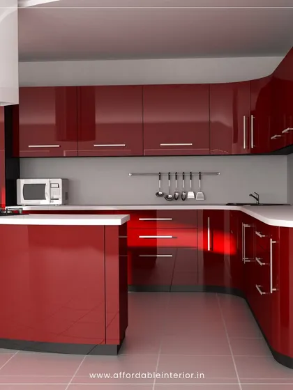 A bold, modern kitchen with high-gloss red cabinets and curved countertops, demonstrating our ability to work with vibrant colors and unique shapes.
