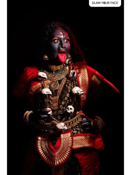 Another powerful portrayal of Goddess Kali, highlighting the dramatic expression and intricate details of the makeup and costume.