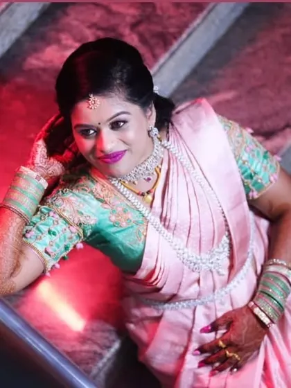 A creative angle showing the full reception look. The makeup is glamorous and designed to stand out in professional photos.
