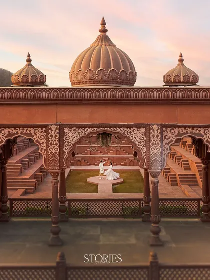 Using a drone, I can capture your love story from a grand perspective. This shot at Sets in the City shows how we can create a truly epic and royal pre-wedding portrait that feels like a scene from a movie.