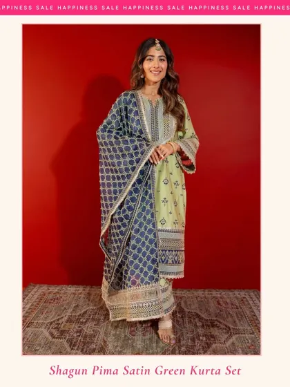 My Shagun Pima Satin Green Kurta Set is perfect for festive occasions. The rich green is paired with a contrasting navy blue dupatta for a truly elegant look.
