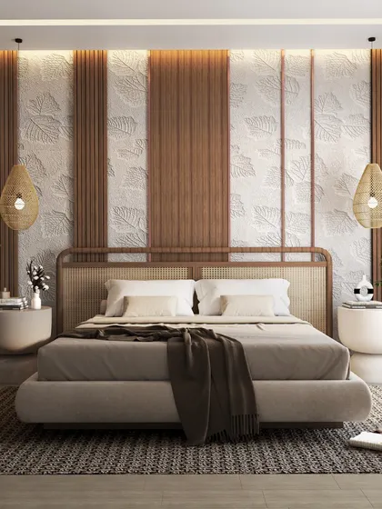 Showcasing the versatility of rattan, this bedroom design combines a woven headboard with a textured wall of wood and embossed panels. The overall effect is natural, calming, and effortlessly chic.