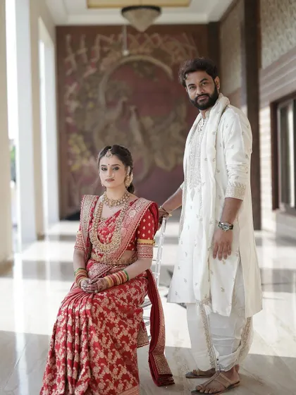 The bride and groom together. Her makeup is designed to be picture perfect, ensuring she looks stunning in all her wedding portraits.