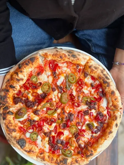 Friday calls for a whole pie! This spicy pizza with jalapeños is the perfect way to kick off the weekend.
