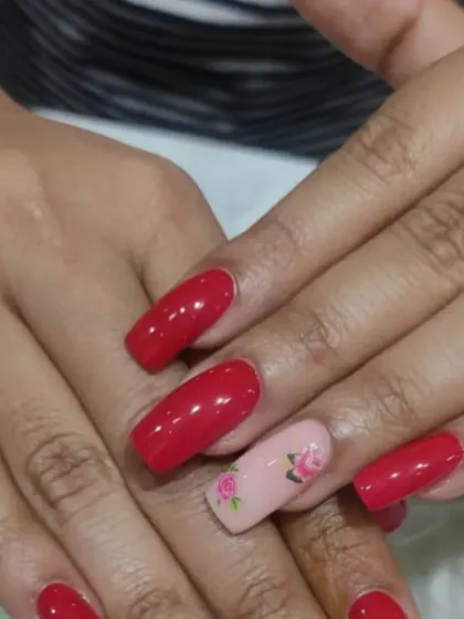 Another view of the lovely red and rose-painted manicure, showing the consistency and detail of our hand-painted art.