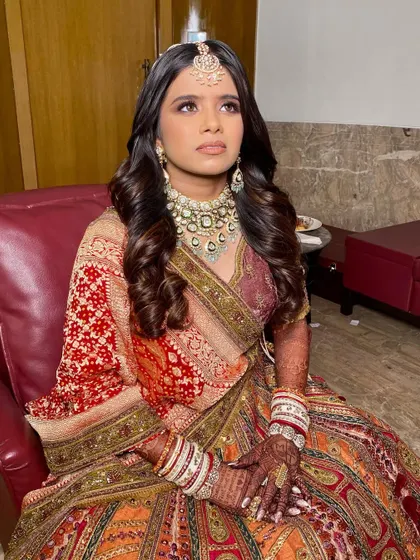 Twinkle looking up, showcasing her beautifully blended eyeshadow. The makeup is designed to look stunning from all angles and in all lighting conditions.