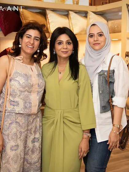 Introducing my latest soft furnishings amidst laughter and joy. This photo captures a moment with some of the lovely guests who made my launch event so unforgettable.